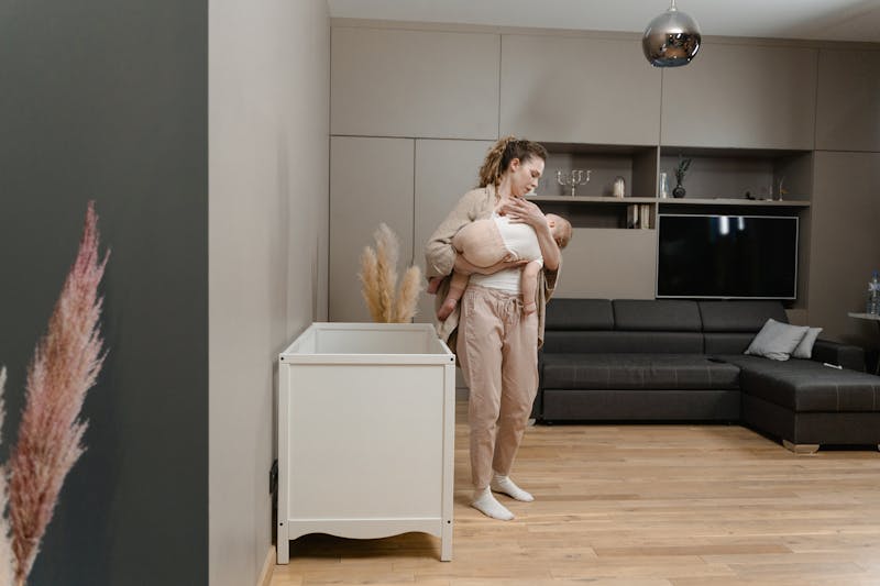 A mother and child sharing a warm, cozy moment — the heart of our community